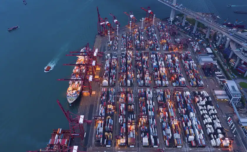 Aerial view of busy container port and cranes